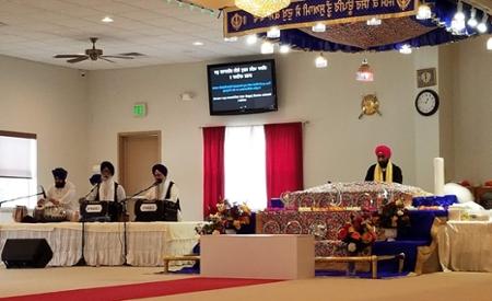 Harvinder Singh, Parminder’s father (on the left) and Amarjeet Singh, her grandfather (third from the left) were leaders in the service of prayer and chanting